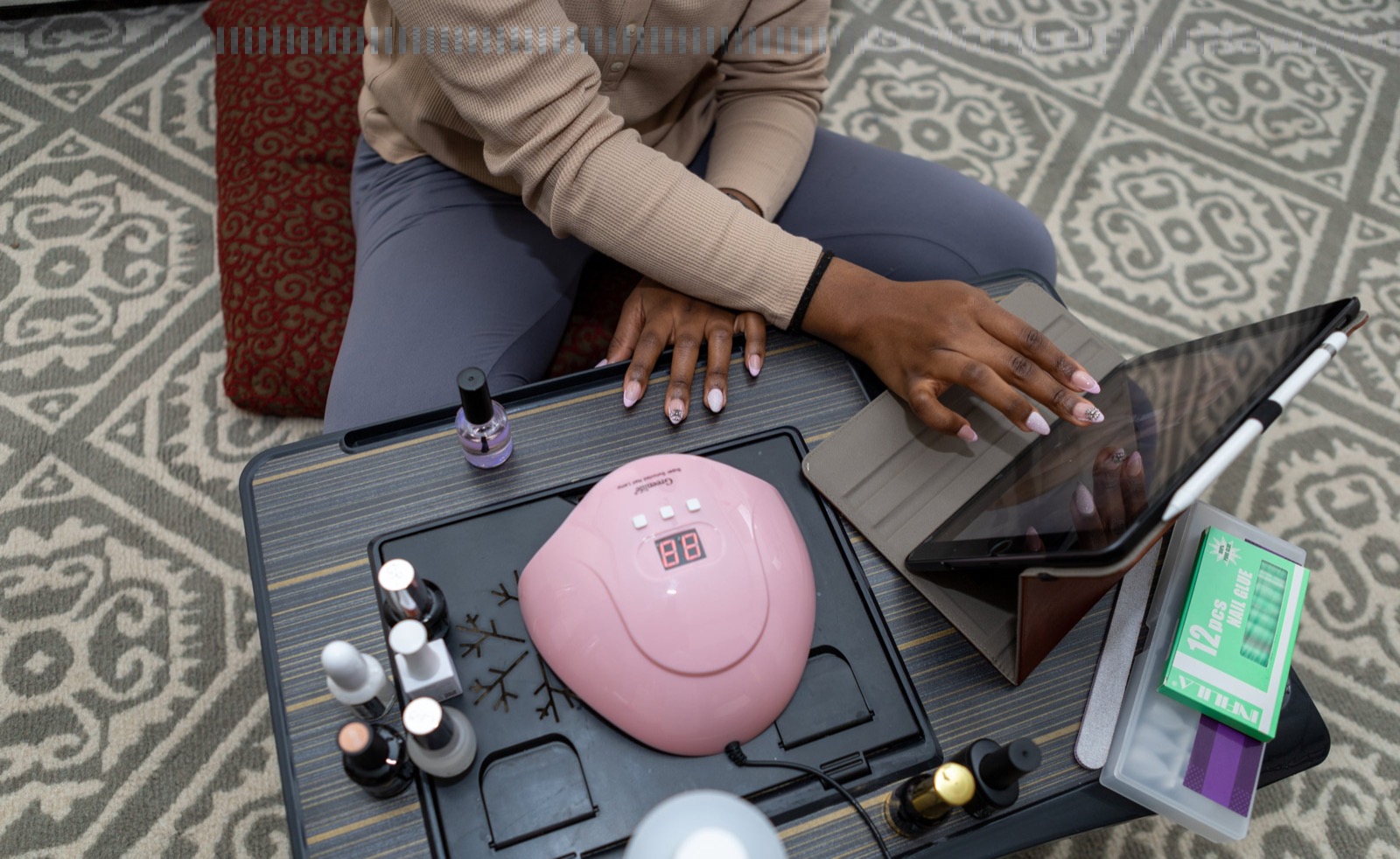 Nail professional delivering a client service